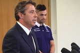 Fremantle Dockers chief executive Steve Rosich talks to the media, as Ryan Crowley looks on.