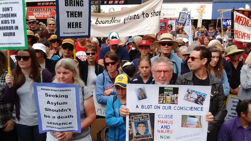 Canberrans rally in Garema Place demanding better treatment of asylum seekers.