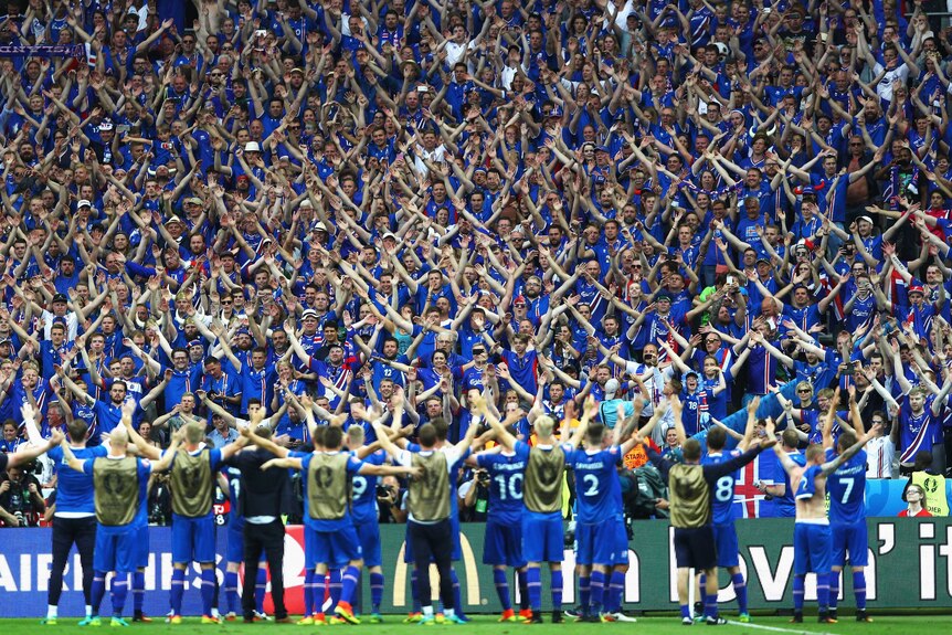 Iceland players celebrate victory with fans