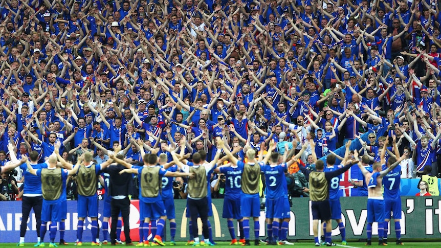 Iceland players celebrate victory with fans