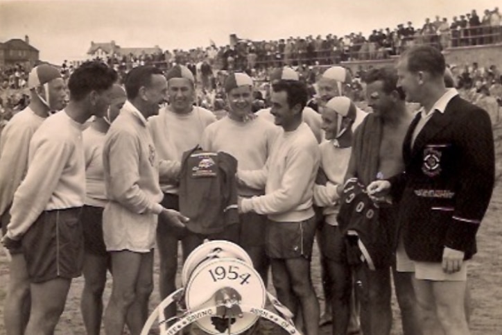 Four men carry out the rescue equipment at Bude in England. Among them is Alan Kennedy and Barrie Cribb.