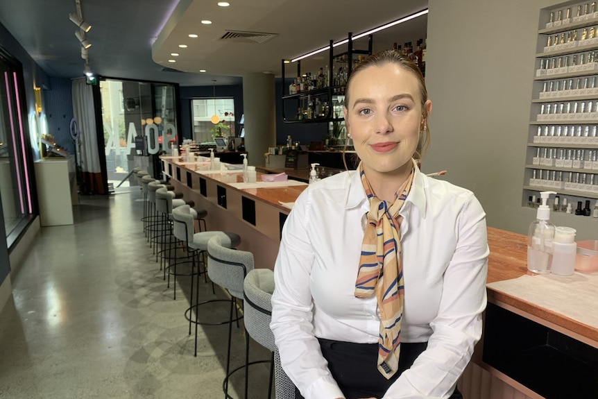 a woman smiling in a beauty salon