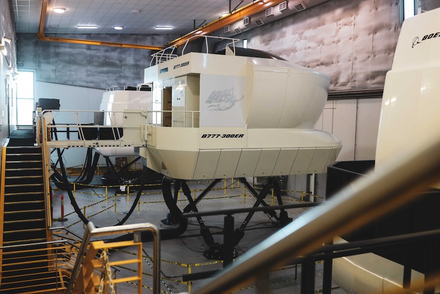 A series of flight simulators at a training facility in Brisbane are now empty.