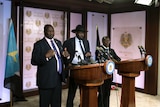 First Vice President Riek Machar (L) delivers a speech next to South Sudan President Salva Kiir (C) prior to the incident.