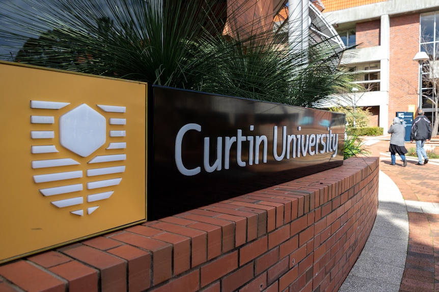 A sign at the entrance to Curtin University