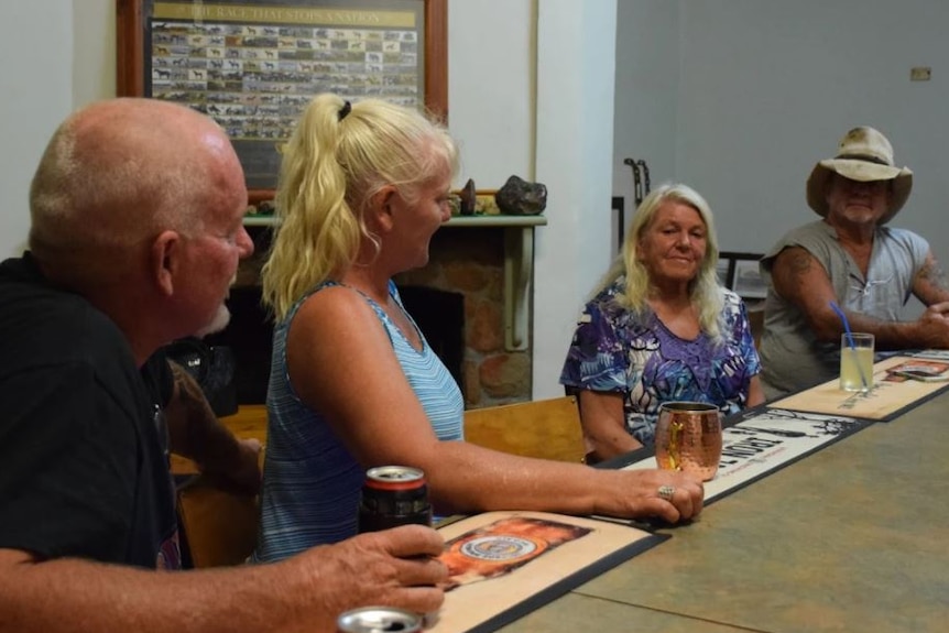 Two men and two women at the bar of a country hotel