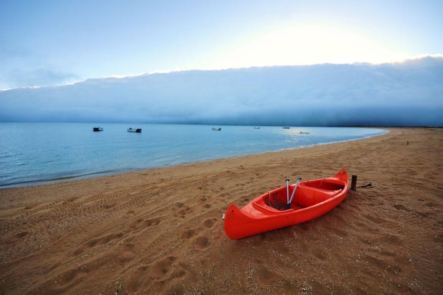 The morning glory cloud forms over Sweers Island.