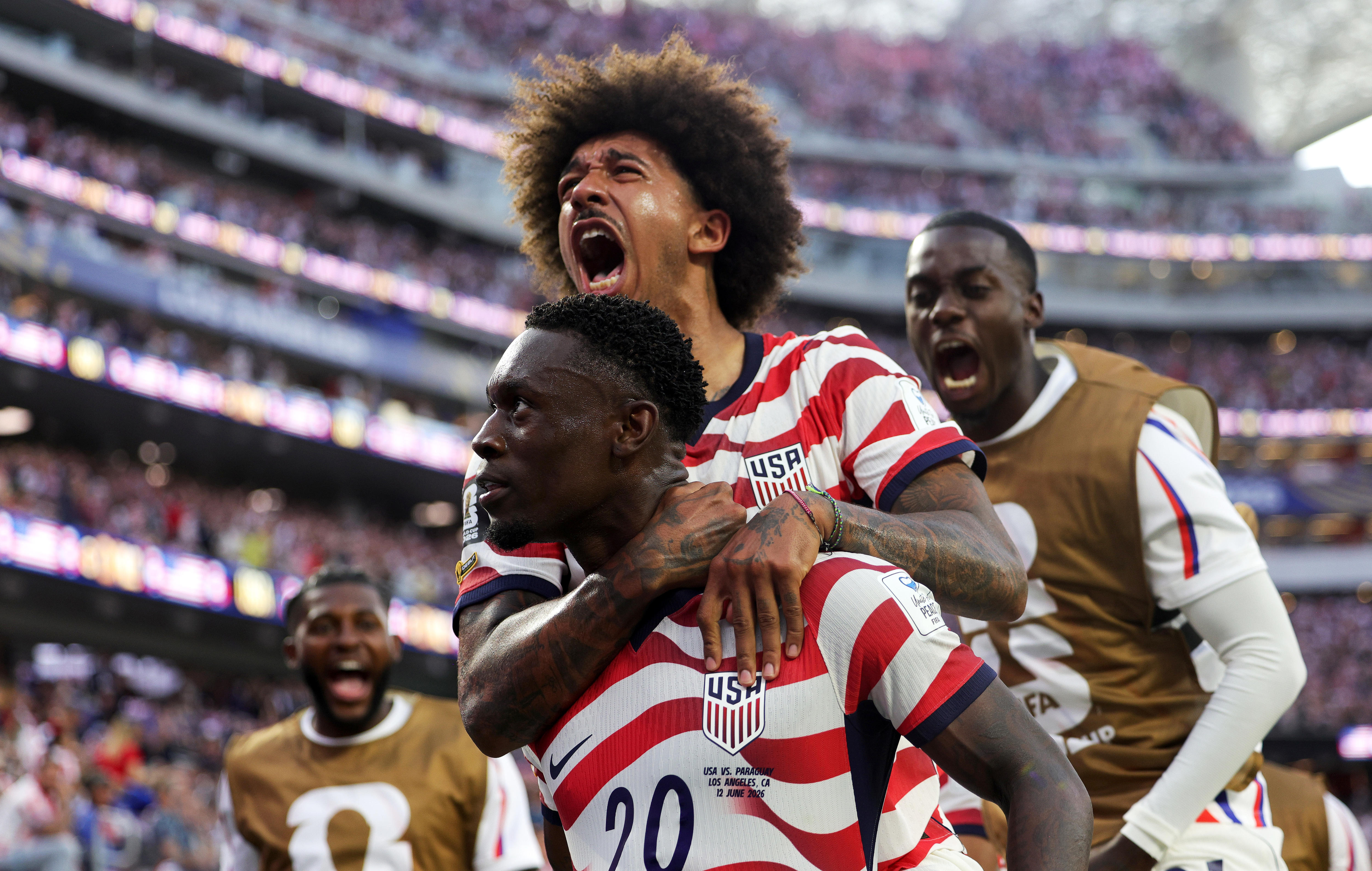 Chris Richards leaps on Folarin Balogun's back in celebration of a goal