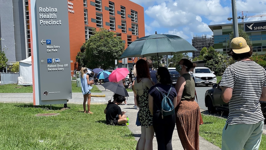 A queue of people outside Robina Hospital on the Gold Coast