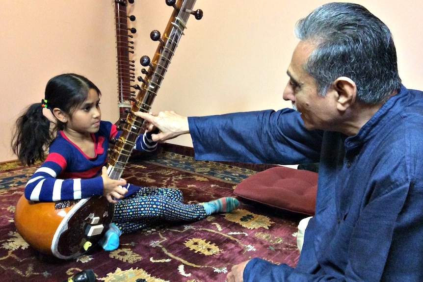 Radhey Gupta teaches young student to play sitar