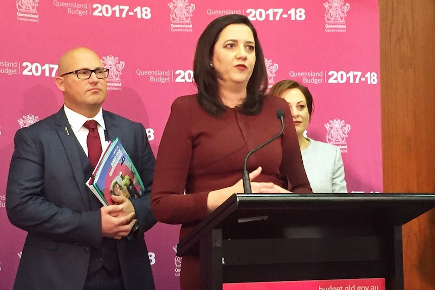 Premier Annastacia Palaszczuk, with Treasurer Curtis Pitt alongside speaks to the media