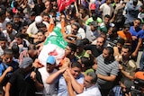 Palestinians attend the funeral of the wife of Hamas military leader Mohammed Deif