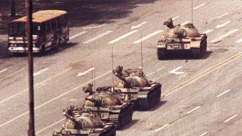 Man stands in front of Chinese Tank