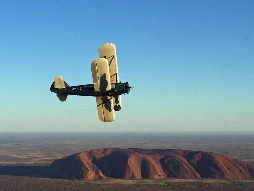 1942 Boeing Stearman Spirit of Artemis flies over Uluru in Australia