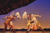 A scene from the stage production of The Lion King, with Robbie Collins as King Mufasa and Josh Quong Tart as Scar