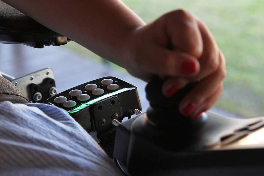 A close-up photo of some dials on a motorised wheelchair.