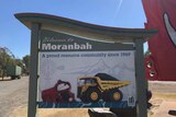 Moranbah town sign showing a coal mine truck