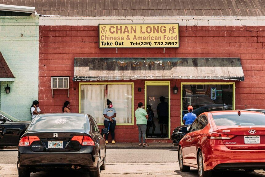 A socially distanced line outside a Chinese restaurant in Cuthbert, Georgia