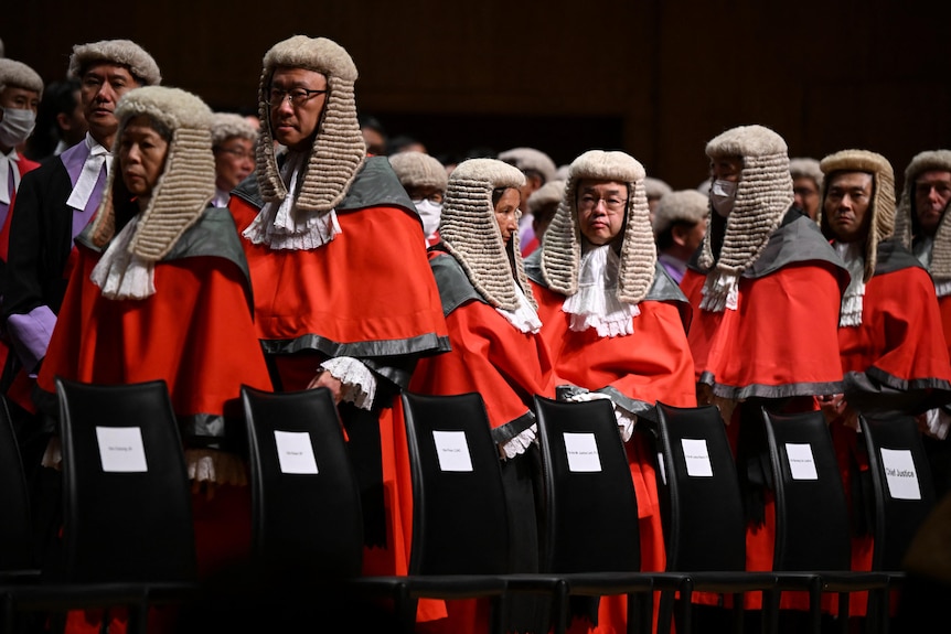 Judges in red robes and wigs.