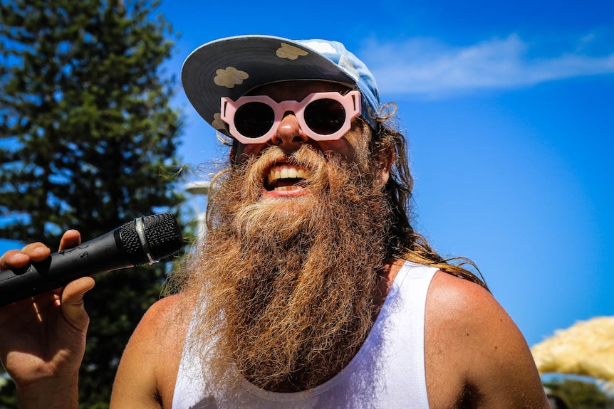 Tommy Franklin smiling with microphone