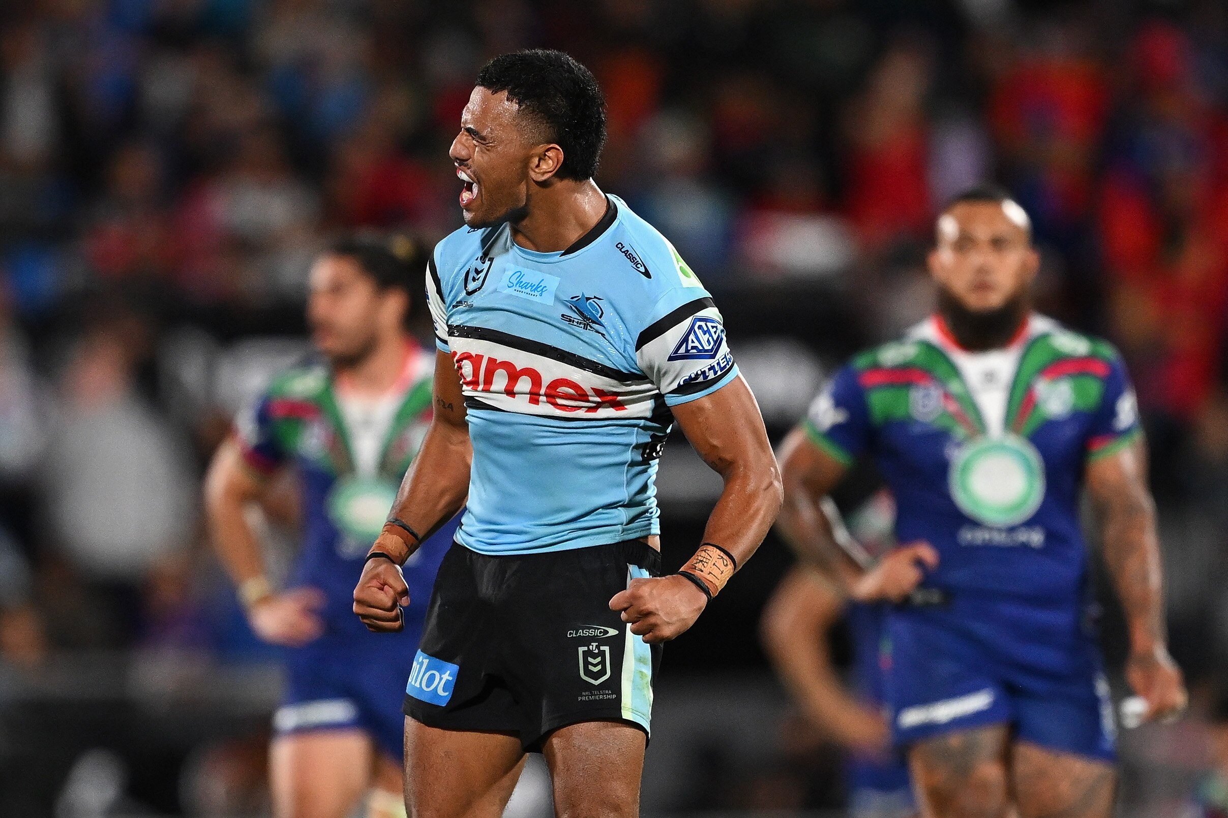 A man celebrates winning a rugby league match
