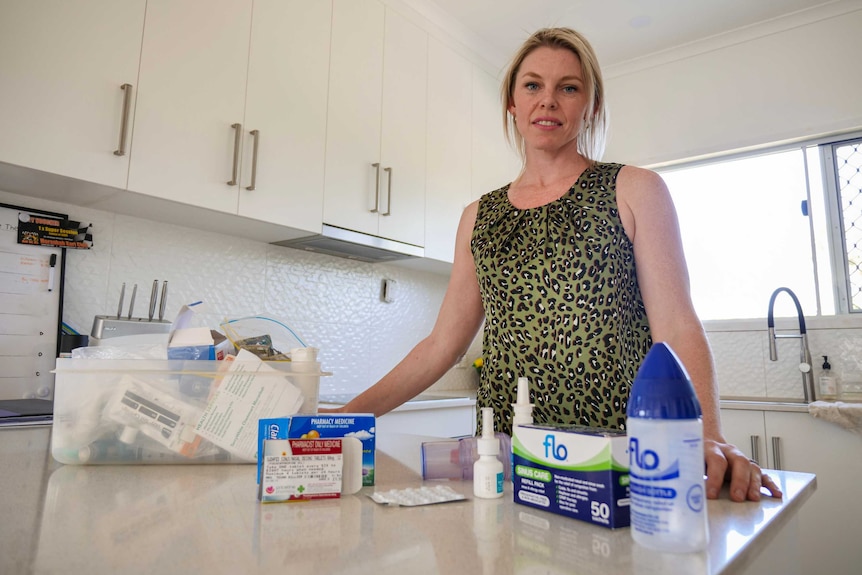 A Moranbah resident displaying her respiratory medication.