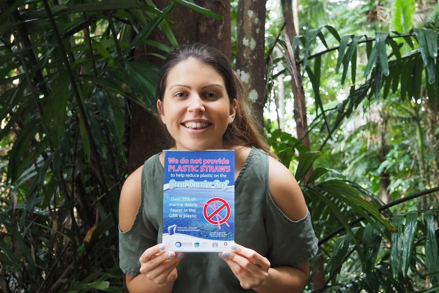Nicole Nash holding anti-plastic straw leaflet