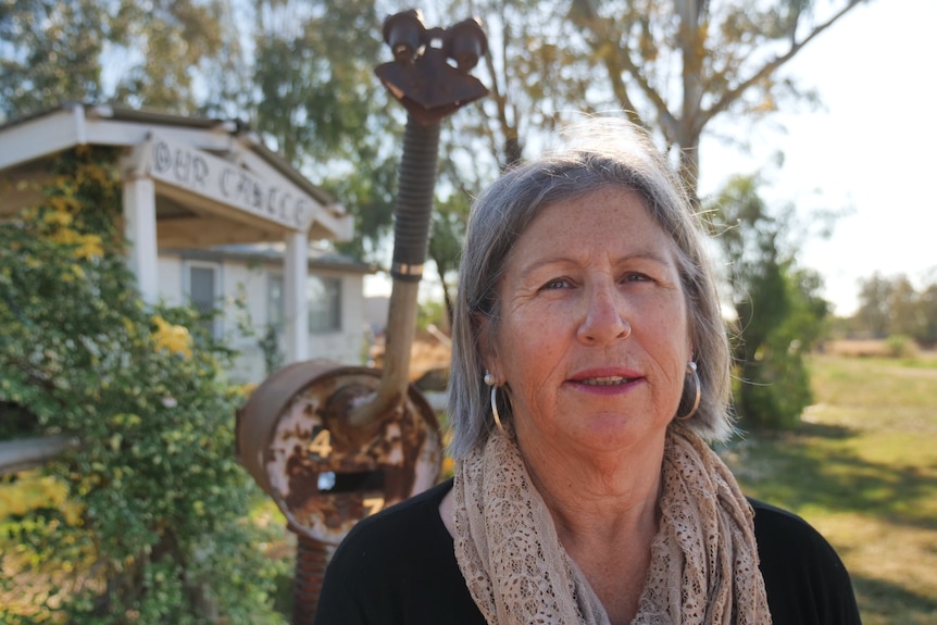 A middle-aged woman in a scarf