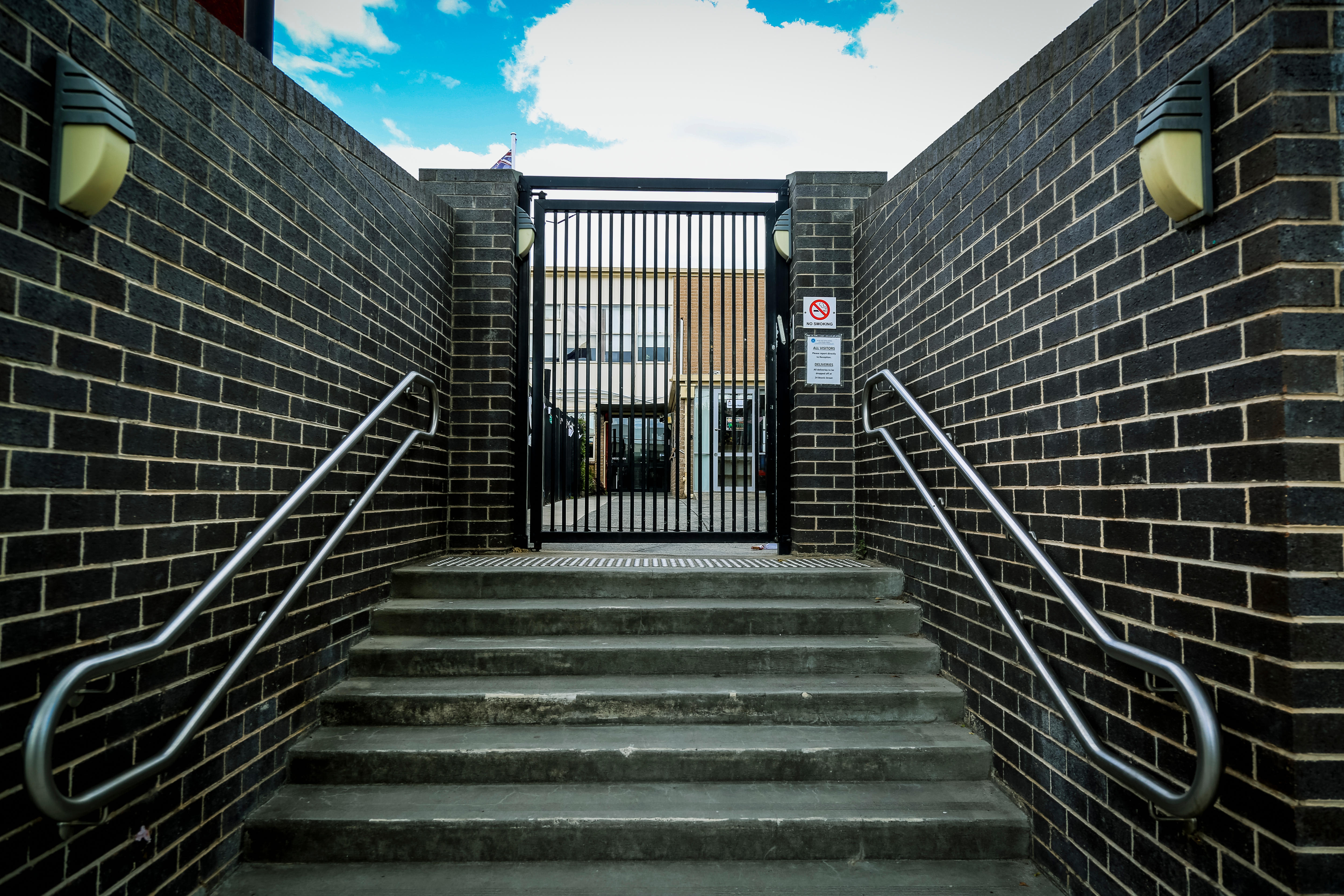 The entrance to the school grounds of Adass Israel School, on a sunny day.