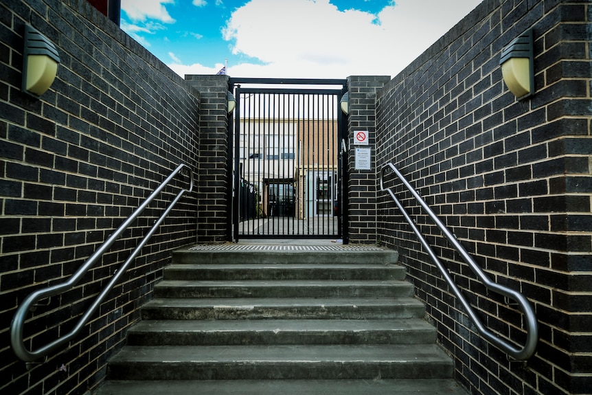 The entrance to the school grounds of Adass Israel School, on a sunny day.