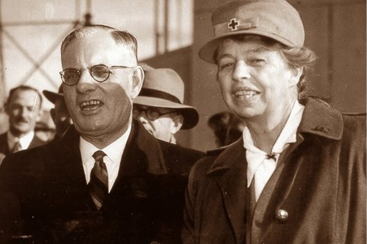 Roosevelt and Curtain smile to the camera, with roosevelt in a cap