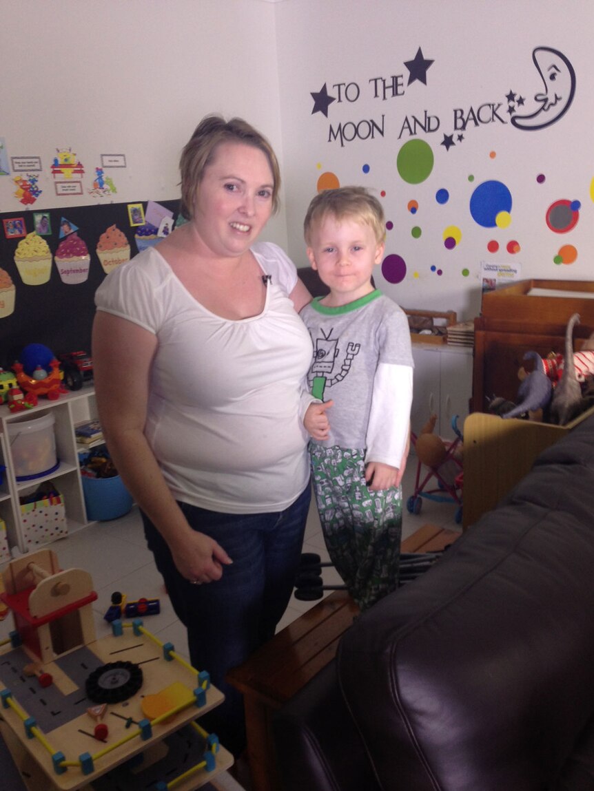 Mother of two Ruth March, with her son Jarrod, at their home in Townsville in north Queensland on May 13, 2014.