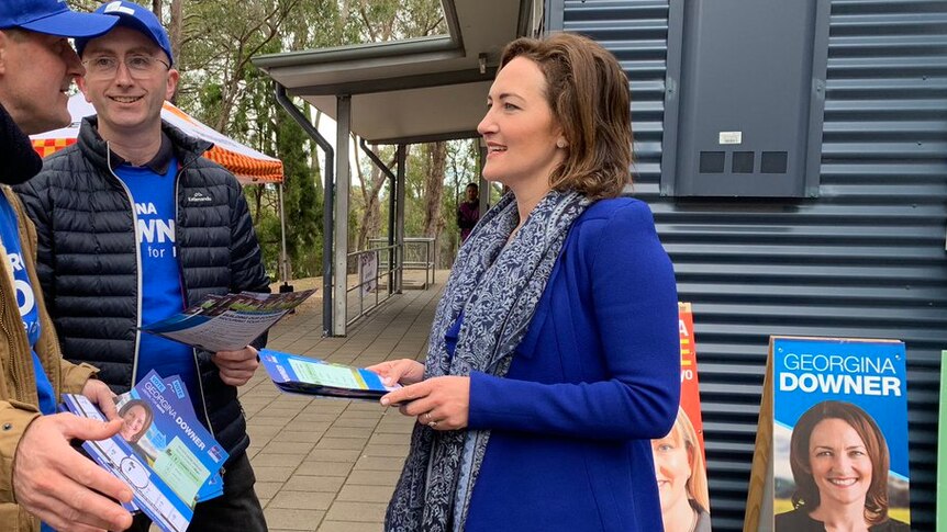 Georgina Downers hands out how-to-vote cards.