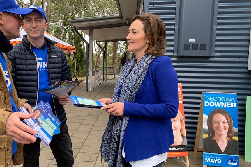 Georgina Downers hands out how-to-vote cards.