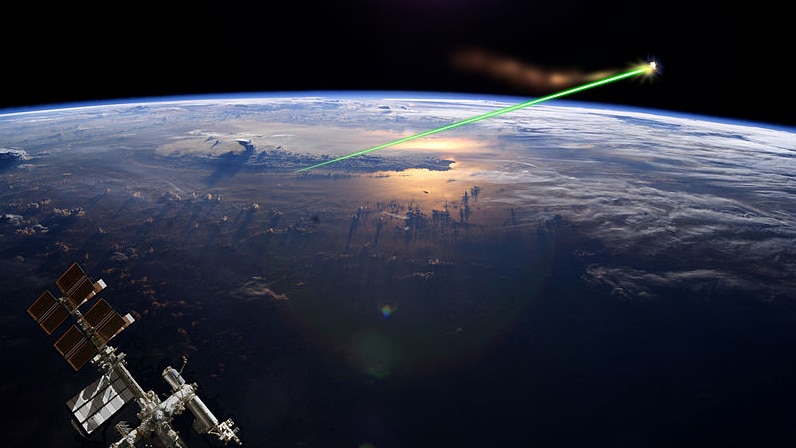 An artists impression of a ground-based laser that would be used to move debris.