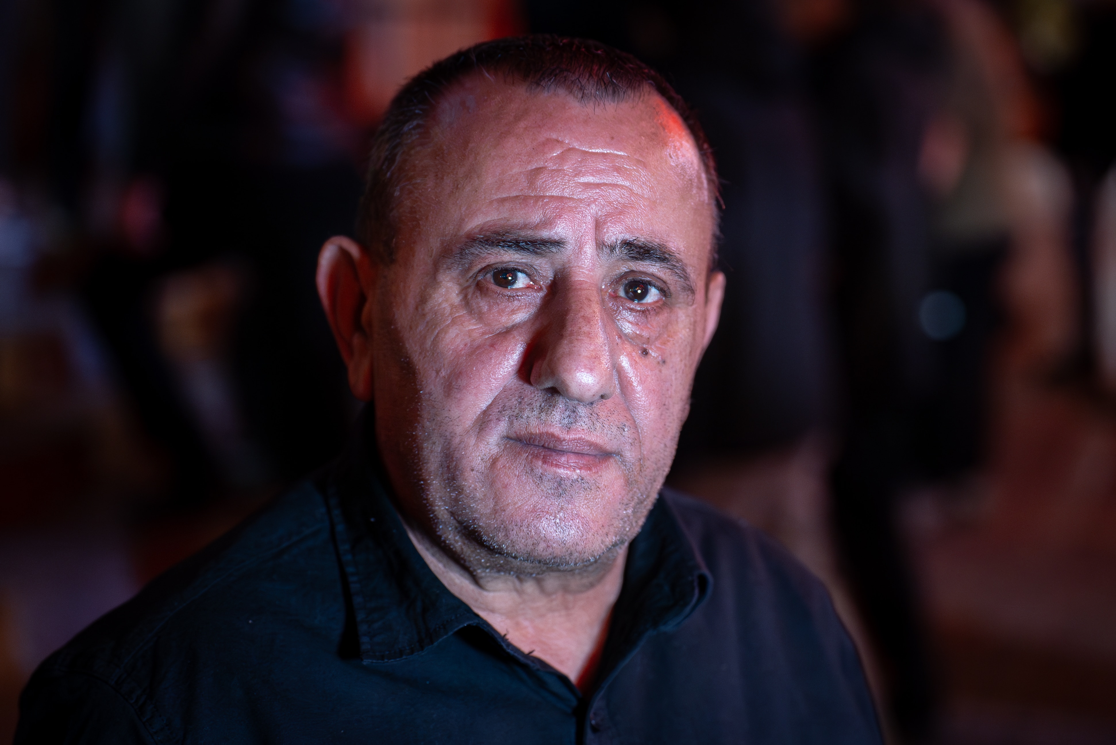 A man in a black shirt.