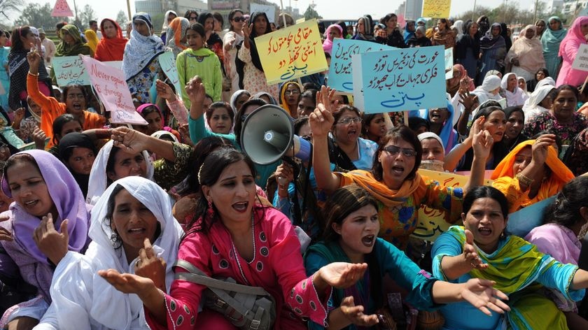 Pakistani women chant slogans during International Women's Day