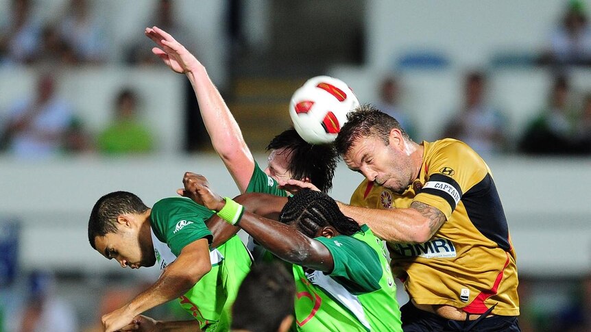 Ljubo Milicevic hangs over the top of a group of Fury players.