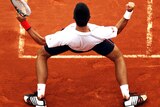 Novak Djokovic celebrates overcoming four match points to claim an epic victory against Jo-Wilfried Tsonga.