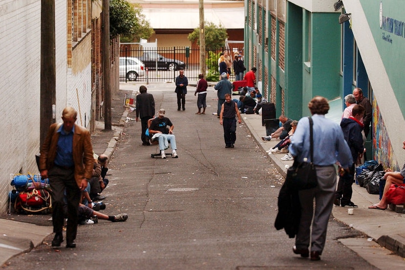 Homeless men gather in the laneway outside a men's hostel Matthew Talbot House in Kings Cross.