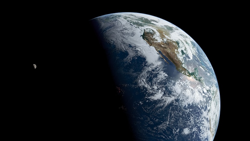 Earth and the Moon captured in a single frame. High clouds near the day-night terminator line glow red with sunrise.