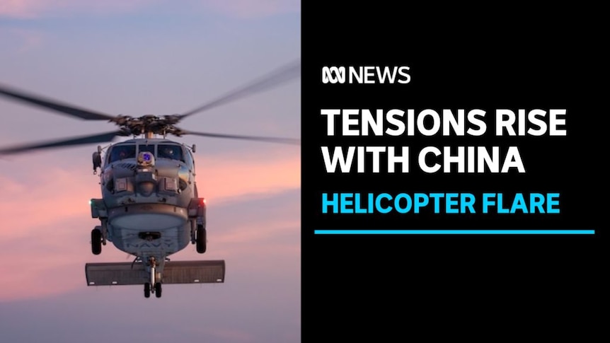 Tensions Rise with China, Helicopter Flare: A seahawk helicopter midflight.