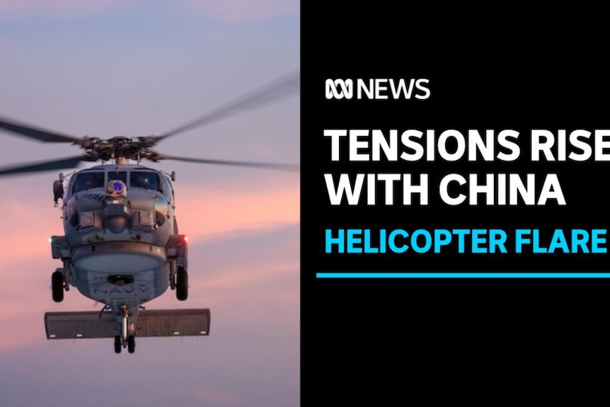Tensions Rise with China, Helicopter Flare: A seahawk helicopter midflight.