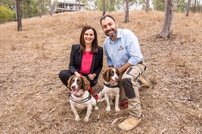 Water sniffer dogs Danny and Halo, with Queensland Urban Utilities spokeswoman Michelle Cull and dog handler Dennis Gannaway.