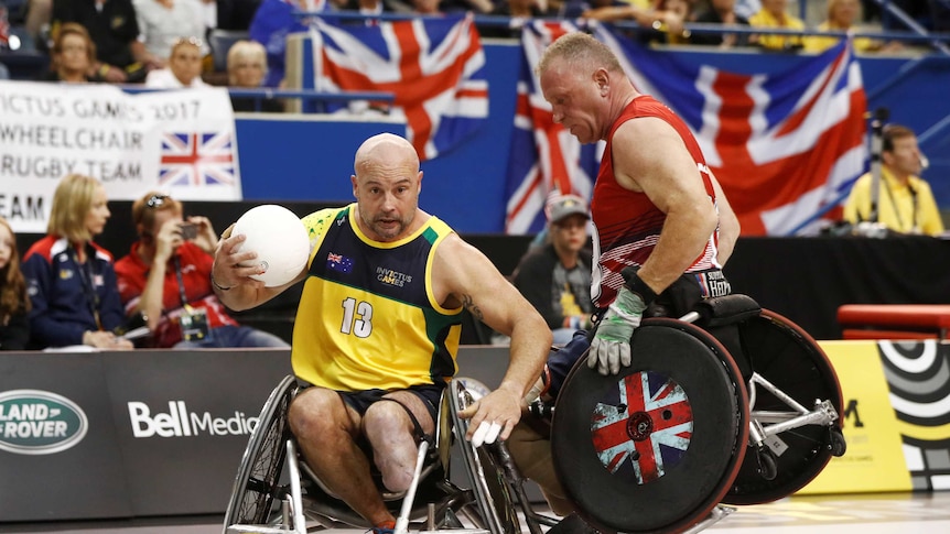 Competitors from Britain and Australia collide in a game of wheelchair rugby