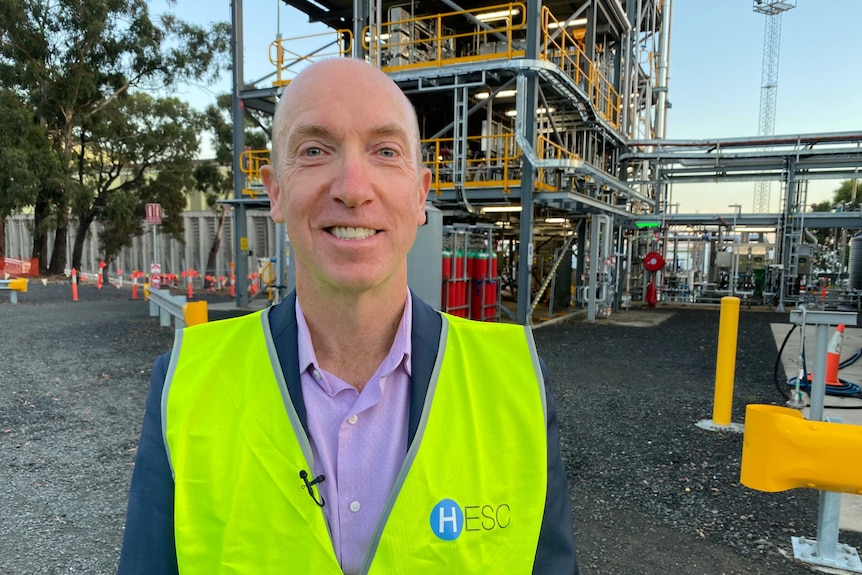 Jeremy Stone standing in front of hydrogen plant