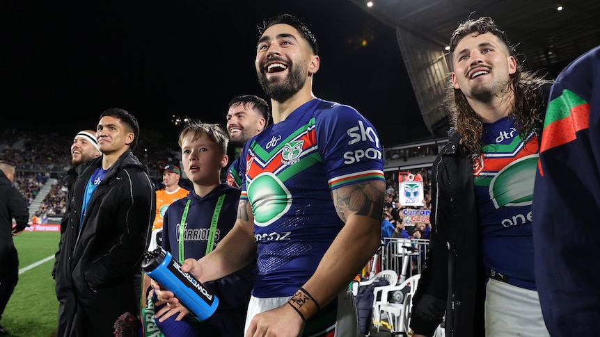 Shaun Johnson and the Warriors smile on the sidelines of their NRL semifinal against the Knights.