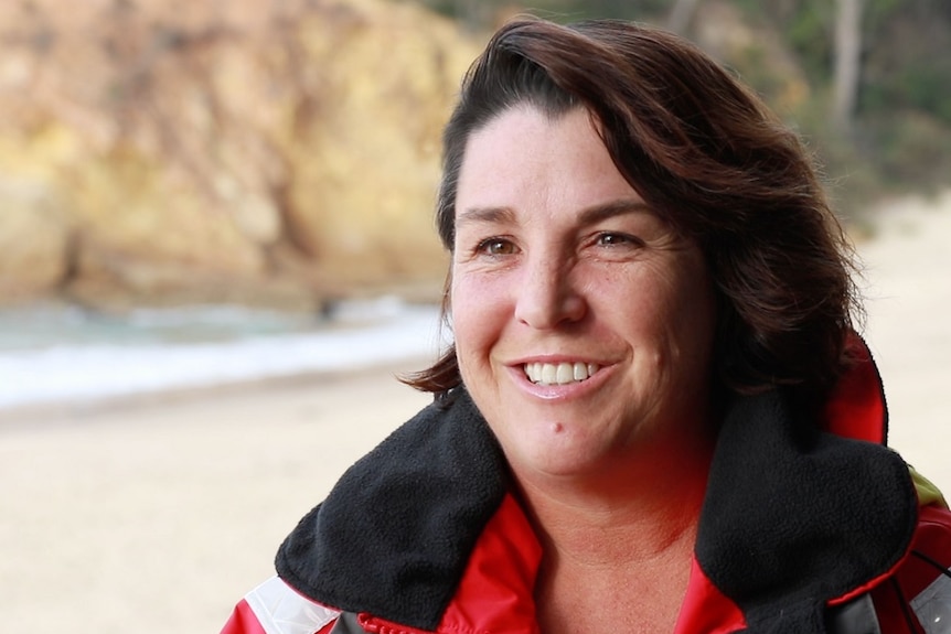 Portrait shot of a woman with brown hair on the beach