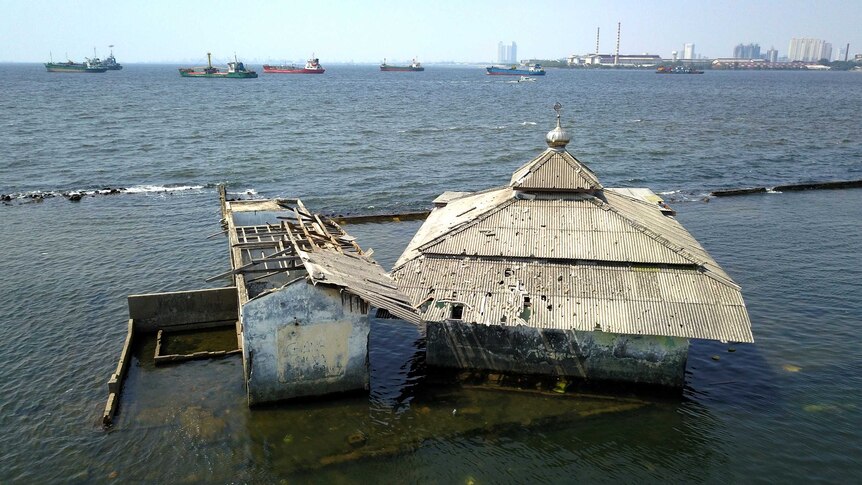 An abandoned mosque in northern Jakarta swamped by water