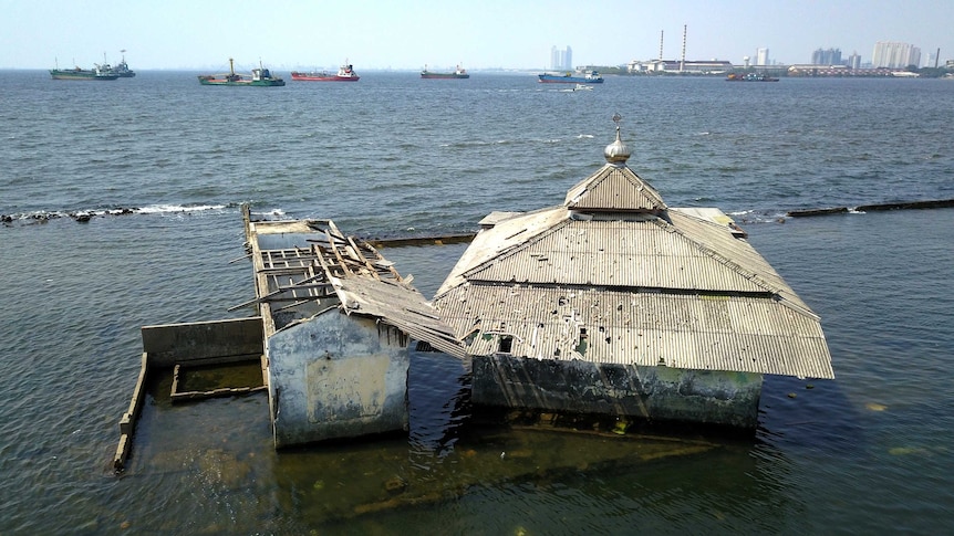 An abandoned mosque in northern Jakarta swamped by water